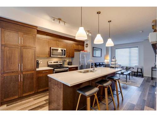 116 Shawnee Common Sw, Calgary, AB - Indoor Photo Showing Kitchen With Double Sink