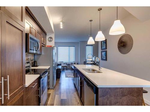 116 Shawnee Common Sw, Calgary, AB - Indoor Photo Showing Kitchen With Double Sink With Upgraded Kitchen