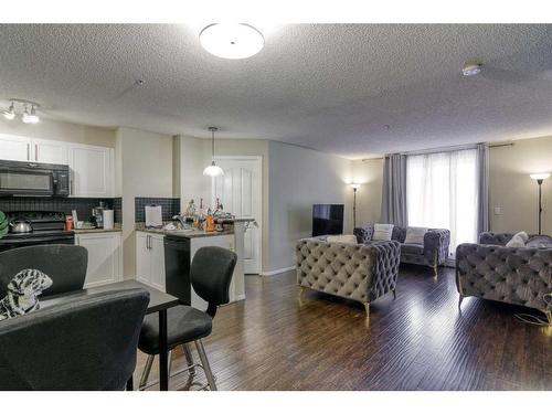 1105-60 Panatella Street Nw, Calgary, AB - Indoor Photo Showing Living Room