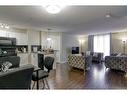 1105-60 Panatella Street Nw, Calgary, AB  - Indoor Photo Showing Living Room 