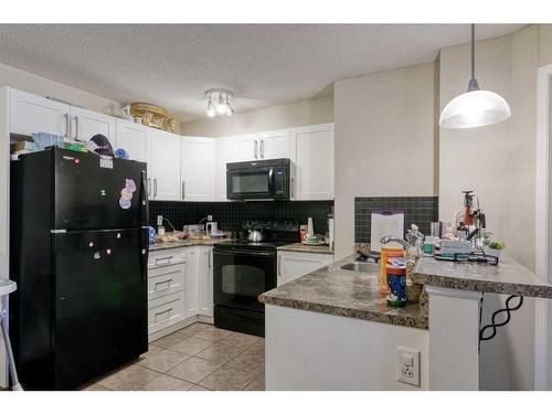 1105-60 Panatella Street Nw, Calgary, AB - Indoor Photo Showing Kitchen