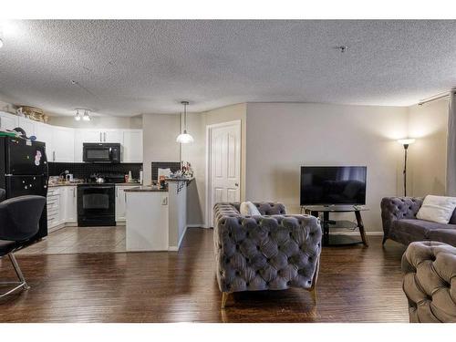 1105-60 Panatella Street Nw, Calgary, AB - Indoor Photo Showing Living Room