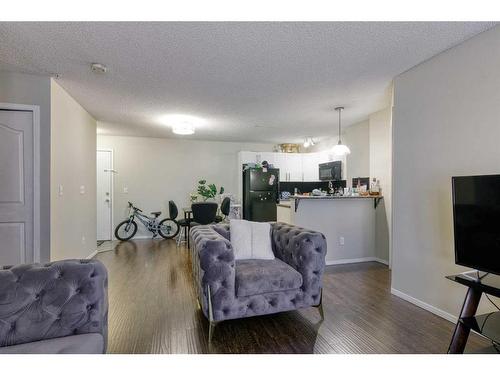 1105-60 Panatella Street Nw, Calgary, AB - Indoor Photo Showing Living Room