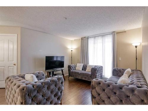 1105-60 Panatella Street Nw, Calgary, AB - Indoor Photo Showing Living Room