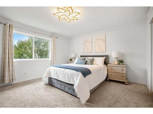 82 Evansmeade Circle Nw, Calgary, AB - Indoor Photo Showing Bedroom