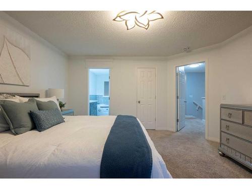 82 Evansmeade Circle Nw, Calgary, AB - Indoor Photo Showing Bedroom