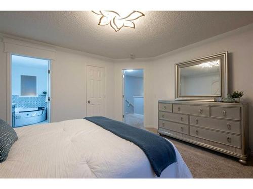 82 Evansmeade Circle Nw, Calgary, AB - Indoor Photo Showing Bedroom