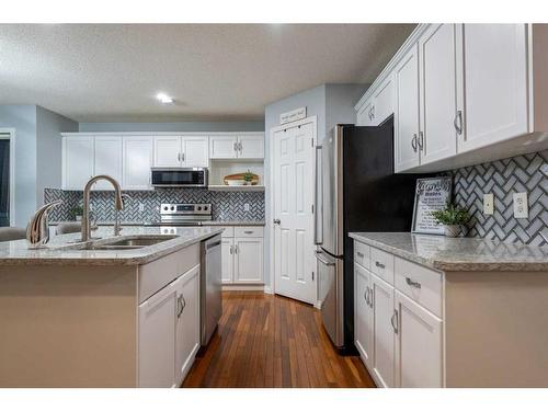 82 Evansmeade Circle Nw, Calgary, AB - Indoor Photo Showing Kitchen With Double Sink