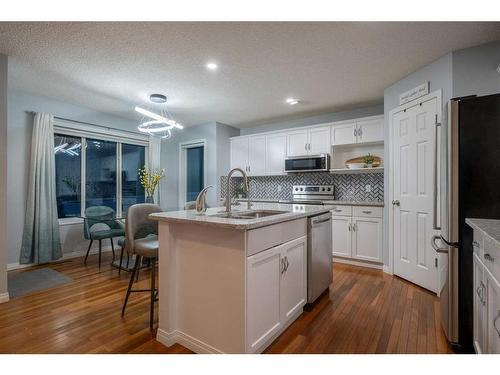 82 Evansmeade Circle Nw, Calgary, AB - Indoor Photo Showing Kitchen With Upgraded Kitchen