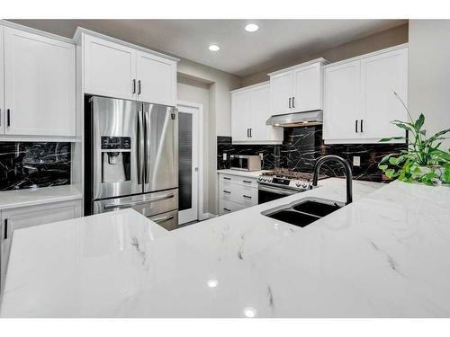 32 Chaparral Valley Terrace Se, Calgary, AB - Indoor Photo Showing Kitchen With Double Sink