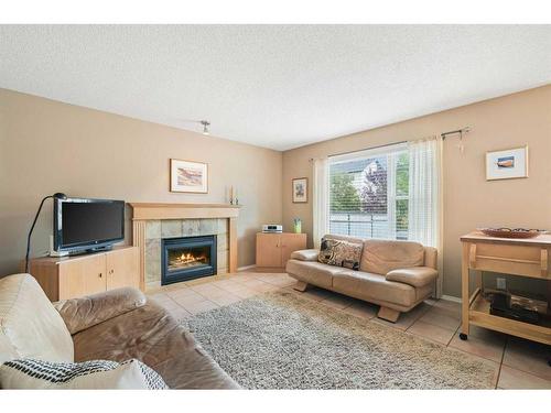 3311 Douglasdale Boulevard Se, Calgary, AB - Indoor Photo Showing Living Room With Fireplace