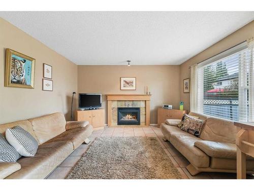 3311 Douglasdale Boulevard Se, Calgary, AB - Indoor Photo Showing Living Room With Fireplace