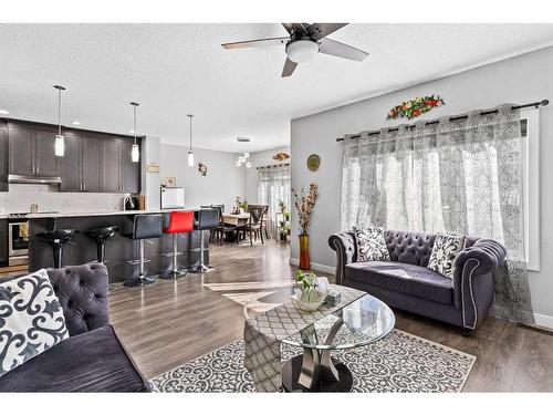 221 Corner Meadows Manor Ne, Calgary, AB - Indoor Photo Showing Living Room With Fireplace