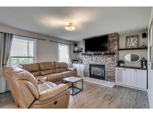 11008 Braton Place Sw, Calgary, AB - Indoor Photo Showing Living Room With Fireplace