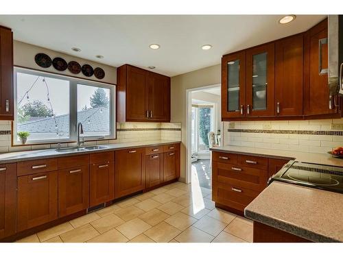 11008 Braton Place Sw, Calgary, AB - Indoor Photo Showing Kitchen With Double Sink