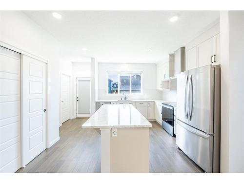 147 Dawson Harbour Hill, Chestermere, AB - Indoor Photo Showing Kitchen With Stainless Steel Kitchen With Upgraded Kitchen