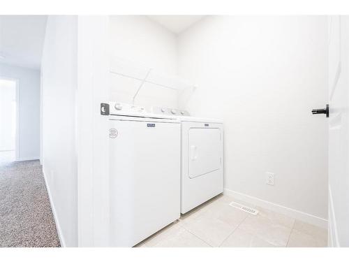 147 Dawson Harbour Hill, Chestermere, AB - Indoor Photo Showing Laundry Room