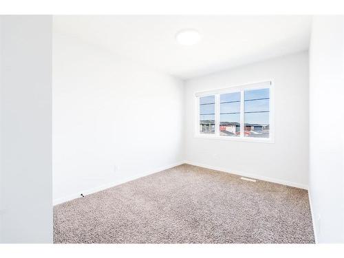 147 Dawson Harbour Hill, Chestermere, AB - Indoor Photo Showing Other Room