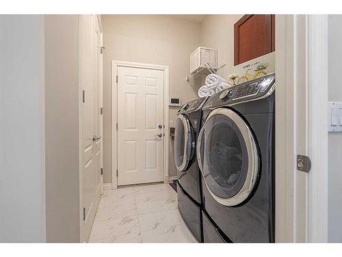 51 Cranleigh Mews Se, Calgary, AB - Indoor Photo Showing Laundry Room