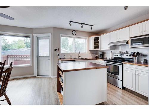 171 Bridlewood Common Sw, Calgary, AB - Indoor Photo Showing Kitchen With Double Sink