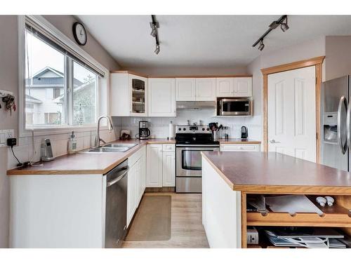 171 Bridlewood Common Sw, Calgary, AB - Indoor Photo Showing Kitchen With Double Sink