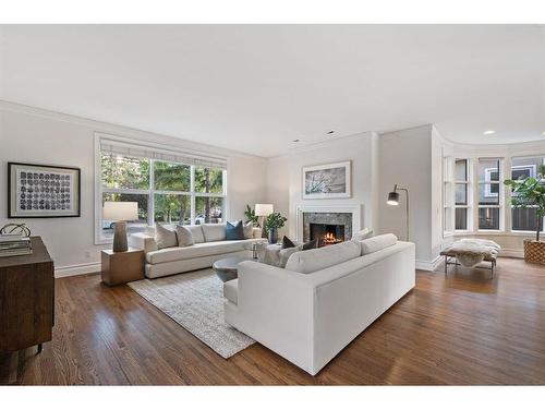 409 Roxboro Road Sw, Calgary, AB - Indoor Photo Showing Living Room With Fireplace