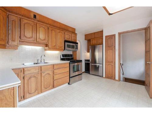 1956 Kelwood Drive Sw, Calgary, AB - Indoor Photo Showing Kitchen With Stainless Steel Kitchen With Double Sink