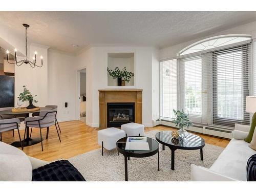 201-1315 12 Avenue Sw, Calgary, AB - Indoor Photo Showing Living Room With Fireplace