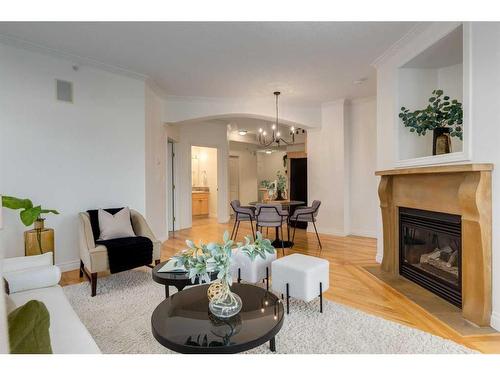 201-1315 12 Avenue Sw, Calgary, AB - Indoor Photo Showing Living Room With Fireplace