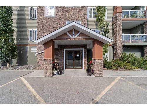 310-4403A 67A Avenue, Olds, AB - Outdoor With Facade