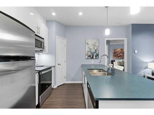 310-4403A 67A Avenue, Olds, AB - Indoor Photo Showing Kitchen With Double Sink