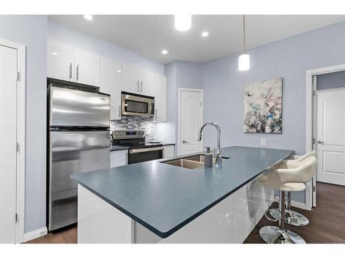 310-4403A 67A Avenue, Olds, AB - Indoor Photo Showing Kitchen With Double Sink With Upgraded Kitchen