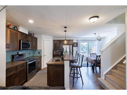 5 Country Village Gate Ne, Calgary, AB - Indoor Photo Showing Kitchen With Double Sink