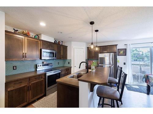 5 Country Village Gate Ne, Calgary, AB - Indoor Photo Showing Kitchen With Stainless Steel Kitchen