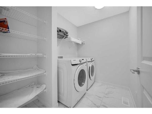 274 Aquila Drive Nw, Calgary, AB - Indoor Photo Showing Laundry Room