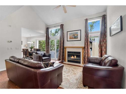 203 Edgedale Gardens Nw, Calgary, AB - Indoor Photo Showing Living Room With Fireplace