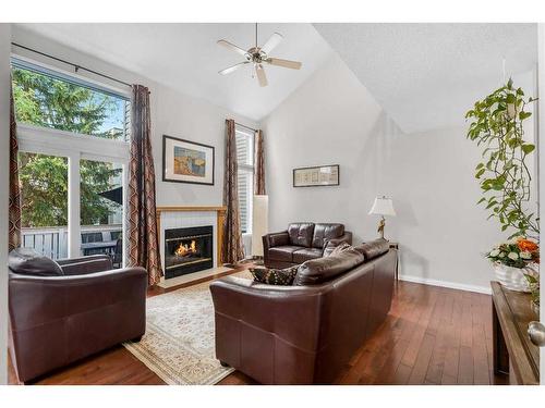 203 Edgedale Gardens Nw, Calgary, AB - Indoor Photo Showing Living Room With Fireplace