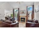 203 Edgedale Gardens Nw, Calgary, AB  - Indoor Photo Showing Living Room With Fireplace 