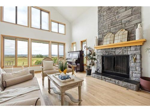 386109 128 Street West, Rural Foothills County, AB - Indoor Photo Showing Living Room With Fireplace