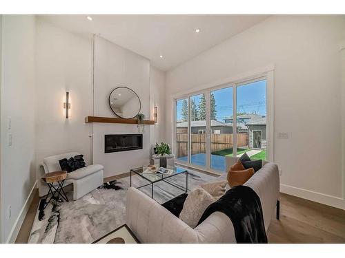 5007 21A Street Sw, Calgary, AB - Indoor Photo Showing Living Room With Fireplace