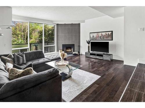 203-1732 9A Street Sw, Calgary, AB - Indoor Photo Showing Living Room With Fireplace