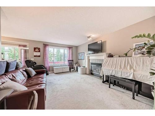 11194 Hidden Valley Drive Nw, Calgary, AB - Indoor Photo Showing Living Room With Fireplace