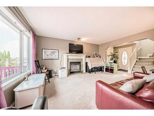 11194 Hidden Valley Drive Nw, Calgary, AB - Indoor Photo Showing Living Room With Fireplace