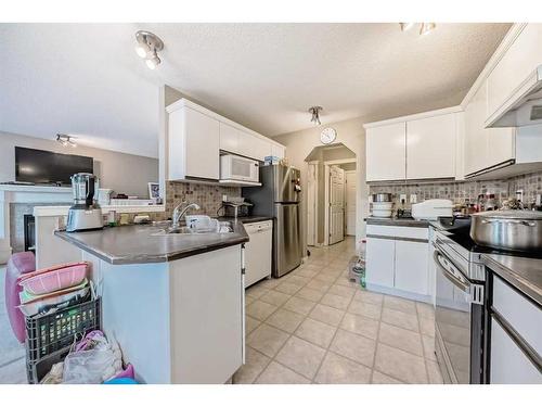 11194 Hidden Valley Drive Nw, Calgary, AB - Indoor Photo Showing Kitchen With Double Sink