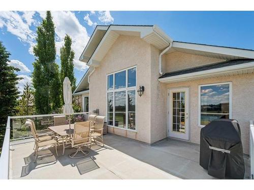 82 Gleneagles Close, Cochrane, AB - Outdoor With Deck Patio Veranda With Exterior