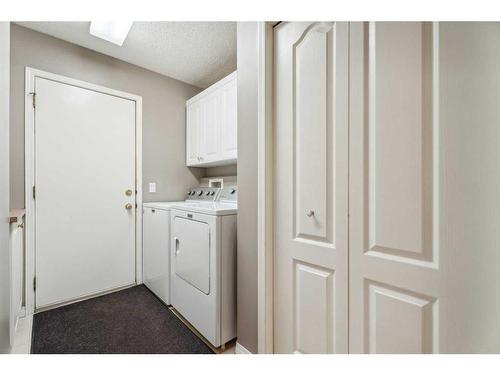 82 Gleneagles Close, Cochrane, AB - Indoor Photo Showing Laundry Room