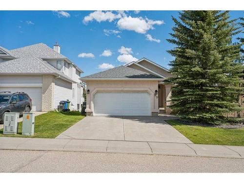 82 Gleneagles Close, Cochrane, AB - Outdoor With Facade