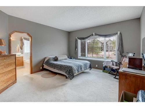 5 Rocky Ridge Gardens Nw, Calgary, AB - Indoor Photo Showing Bedroom