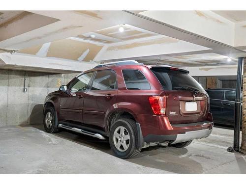 102-1516 11 Avenue Sw, Calgary, AB - Indoor Photo Showing Garage