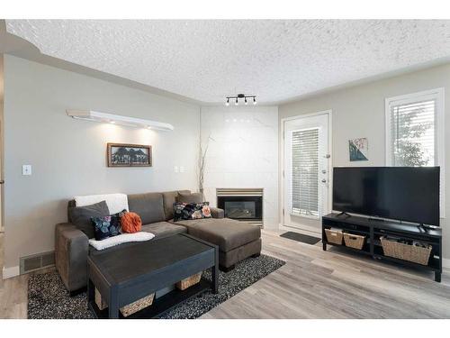 102-1516 11 Avenue Sw, Calgary, AB - Indoor Photo Showing Living Room With Fireplace